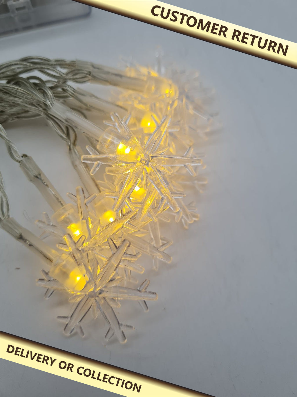 Battery-Powered Snowflake LED String Lights â€” photograph 1 — Customer return; auction delivery information shown on image