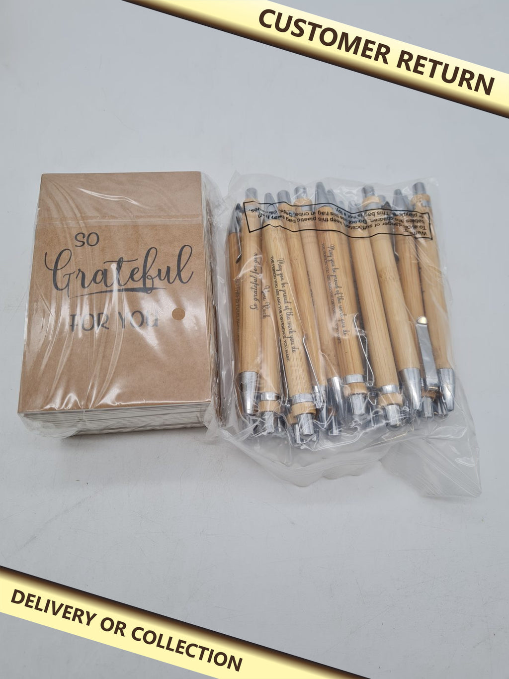 20-Piece Appreciation Notebook and Bamboo Ballpoint Pen Gift Set â€” photograph 1 — Customer return; auction delivery information shown on image