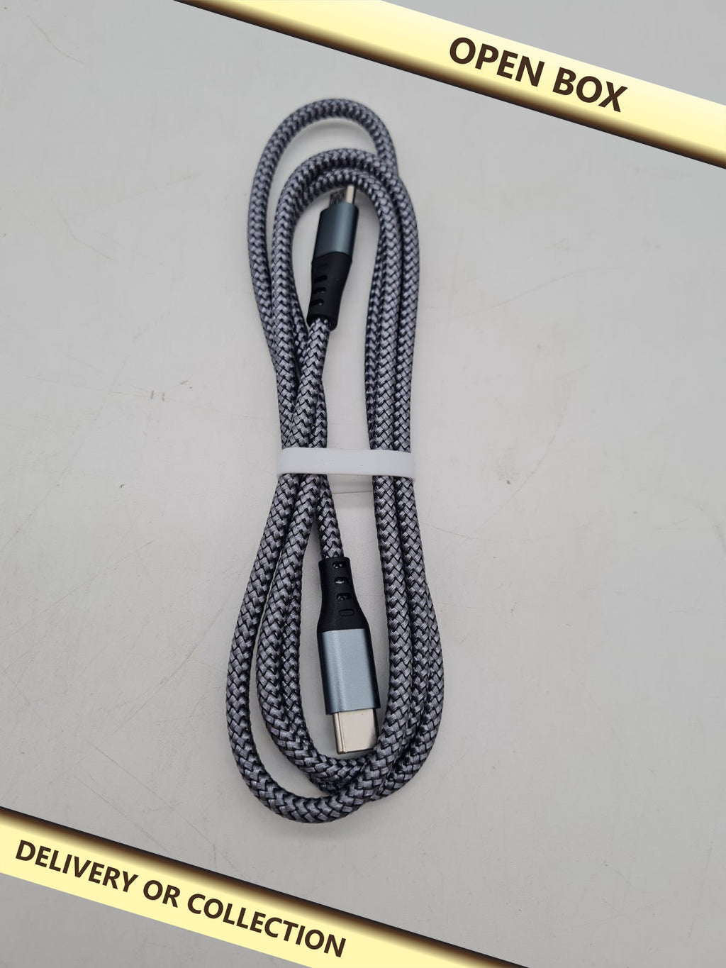 USB-C to Micro-USB Cable â€” photograph 1 — Open box; auction delivery information shown on image