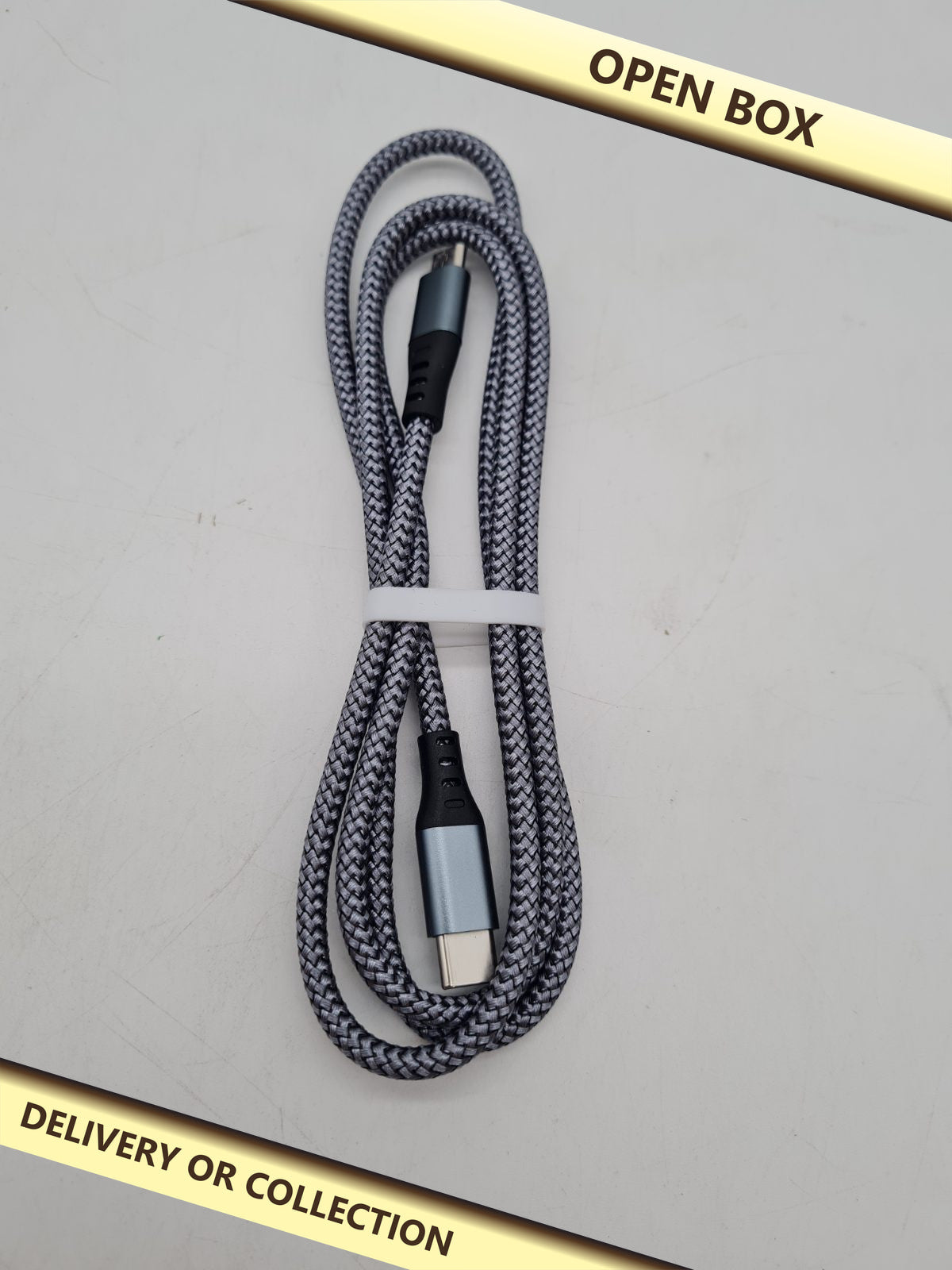 USB-C to Micro-USB Cable â€” photograph 1 — Open box; auction delivery information shown on image